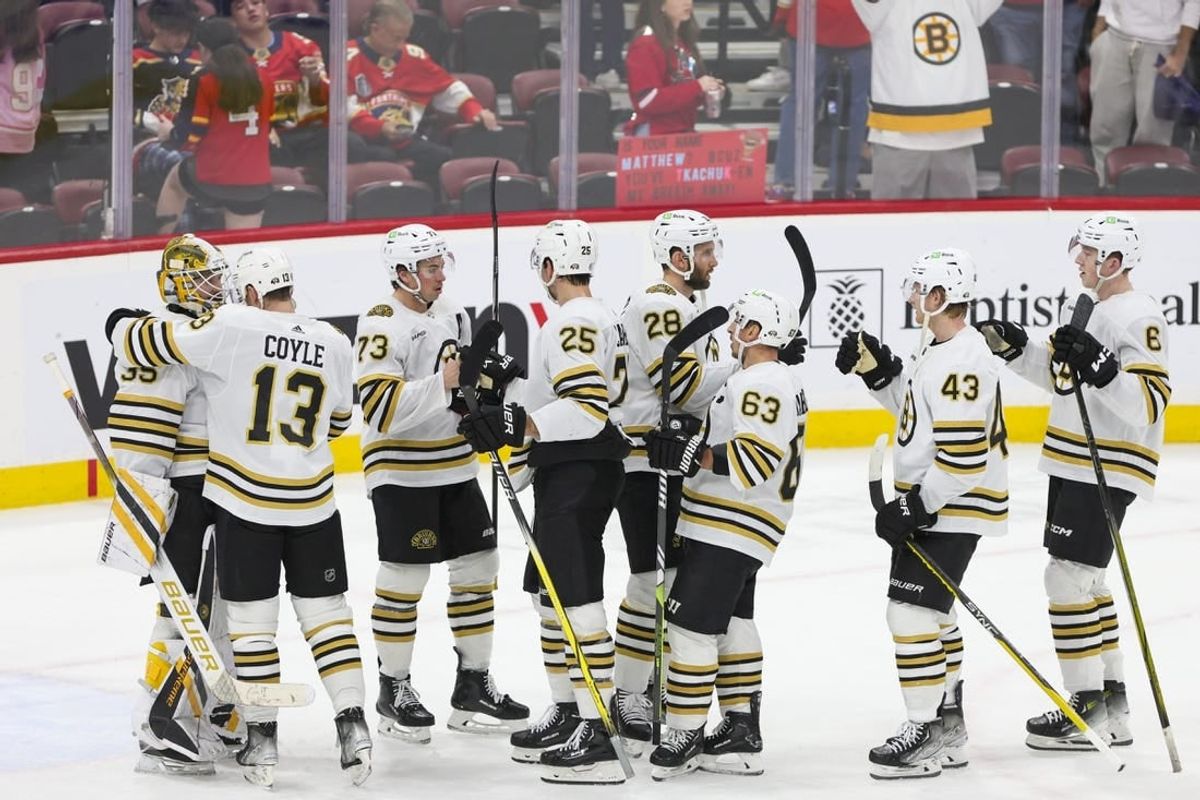 Nov 22, 2023; Sunrise, Florida, USA; The Boston Bruins celebrate after winning the game against the Florida Panthers at Amerant Bank Arena.