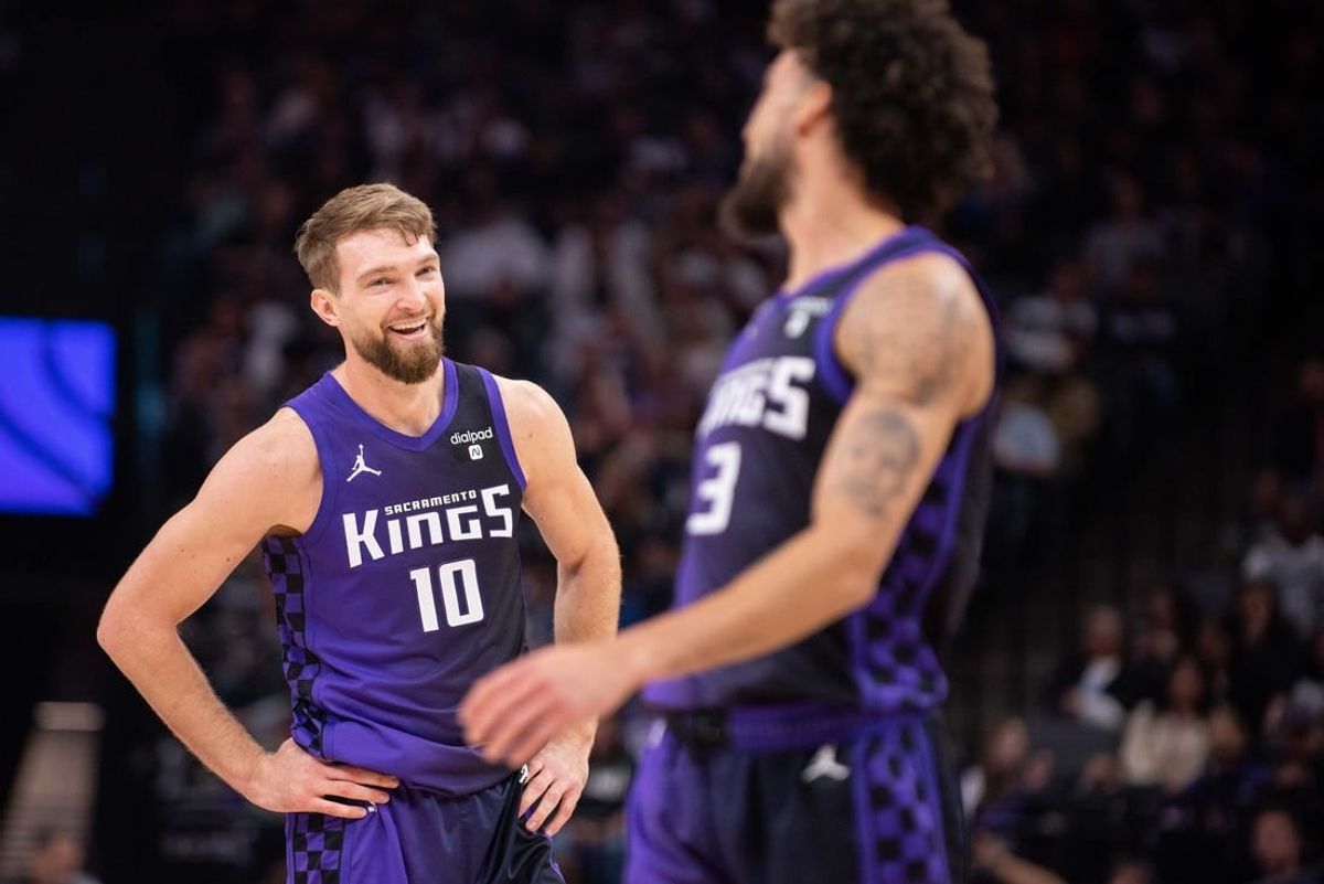 Mar 4, 2024; Sacramento, California, USA; Sacramento Kings forward Domantas Sabonis (10) smiles at guard Chris Duarte (3) during the second quarter at Golden 1 Center.