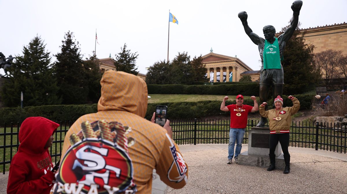 49ers fans pose with the Rocky statue outside the Philadelphia Museum of Art on Jan.  28, 2023,  in Philadelphia .