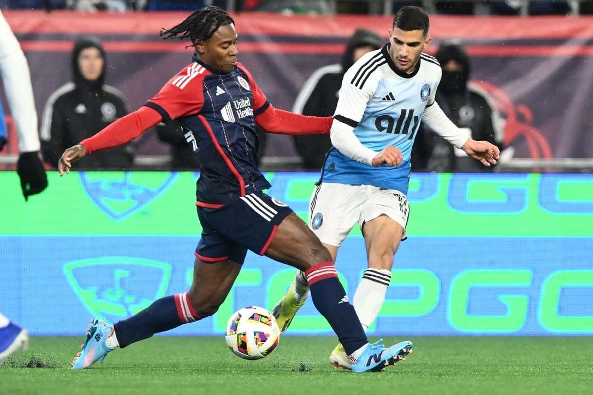 Apr 6, 2024; Foxborough, Massachusetts, USA; New England Revolution defender DeJuan Jones (24) holds possession of the ball during his MLS soccer match against Charlotte FC at Gillette Stadium.
