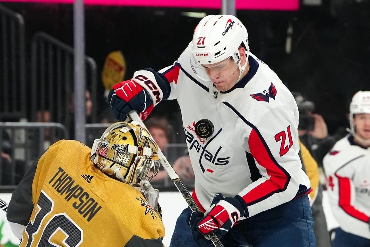 Dec 2, 2023; Las Vegas, Nevada, USA; Vegas Golden Knights goaltender Logan Thompson (36) deflects the puck into the chest of Washington Capitals center Aliaksei Protas (21)  during the first period at T-Mobile Arena.