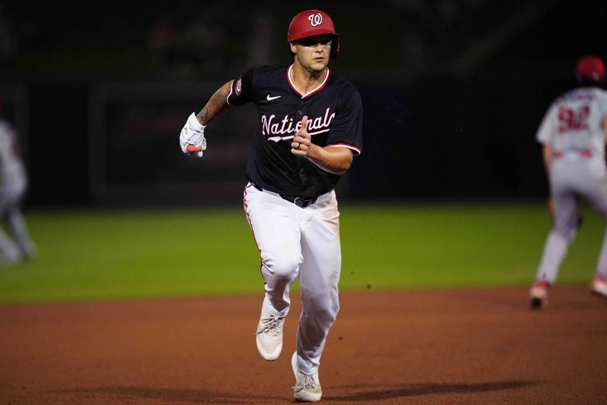 Mar 8, 2024; West Palm Beach, Florida, USA; Washington Nationals third baseman Nick Senzel (13) advances to third base on a base hit in the fourth inning against the St. Louis Cardinals at CACTI Park of the Palm Beaches.
