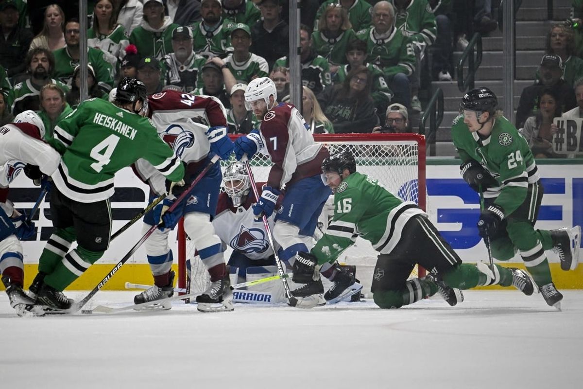 May 9, 2024; Dallas, Texas, USA; Dallas Stars center Joe Pavelski (16) and defenseman Miro Heiskanen (4) and center Roope Hintz (24) Colorado Avalanche defenseman Josh Manson (42) and goaltender Alexandar Georgiev (40) and defenseman Devon Toews (7) battle for control of the puck in the Colorado crease during the first period in game two of the second round of the 2024 Stanley Cup Playoffs at American Airlines Center.