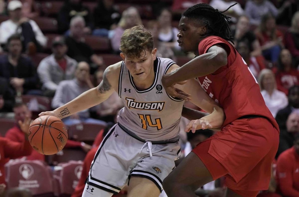 Nov 16, 2023; Charleston, South Carolina, USA; North Texas Mean Green forward Moulaye Sissoko (14) drives around Houston Cougars forward Joseph Tugler (25) in the first half at TD Arena.