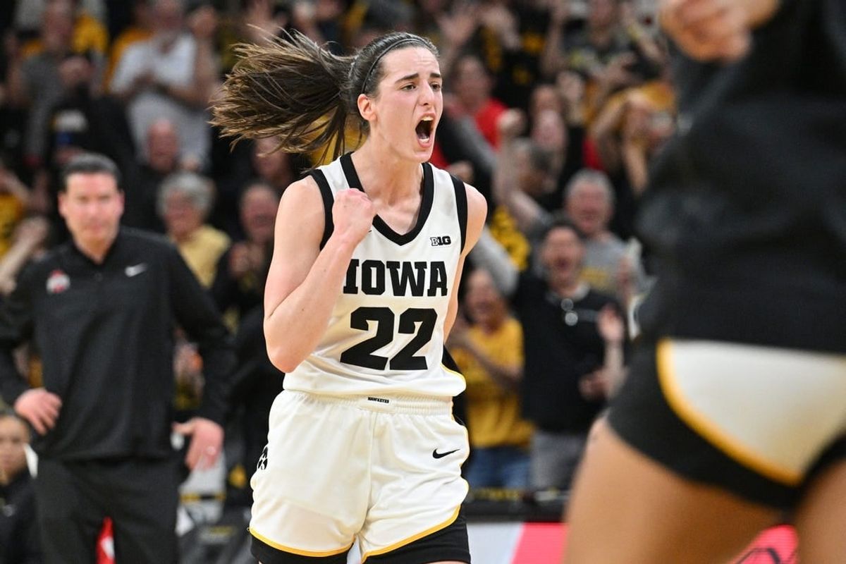 Mar 3, 2024; Iowa City, Iowa, USA; Iowa Hawkeyes guard Caitlin Clark (22) reacts after breaking the NCAA basketball all-time scoring record during the second quarter against the Ohio State Buckeyes.