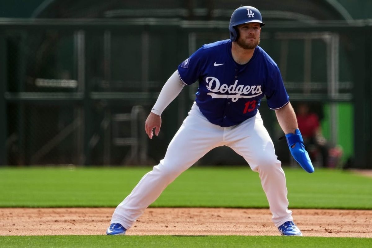 Feb 27, 2024; Phoenix, Arizona, USA; Los Angeles Dodgers third baseman Max Muncy (13) leads off first base during the first inning at Camelback Ranch-Glendale.