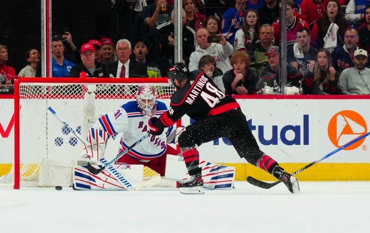May 11, 2024; Raleigh, North Carolina, USA; Carolina Hurricanes left wing Jordan Martinook (48) shoots the puck against New York Rangers goaltender Igor Shesterkin (31) during the second period in game four of the second round of the 2024 Stanley Cup Playoffs at PNC Arena.