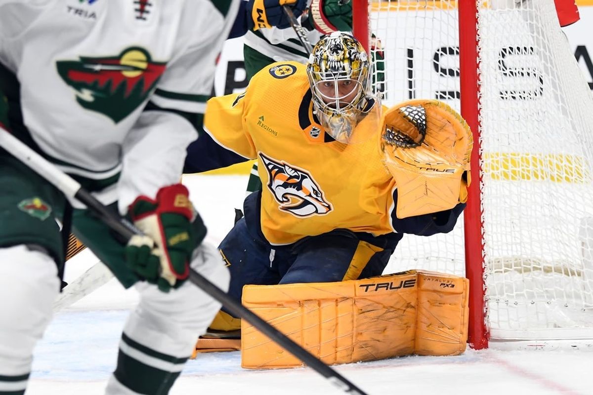 Feb 29, 2024; Nashville, Tennessee, USA; Nashville Predators goaltender Juuse Saros (74) watches the puck as it is played in the corner during the second period against the Minnesota Wild at Bridgestone Arena.
