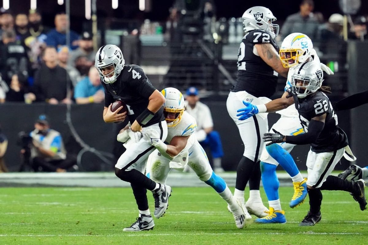 Dec 14, 2023; Paradise, Nevada, USA; Los Angeles Chargers linebacker Eric Kendricks (6) sacks Las Vegas Raiders quarterback Aidan O'Connell (4) in the third quarter at Allegiant Stadium.