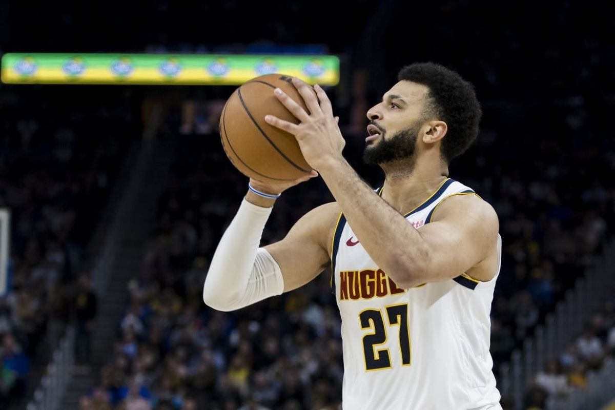 Jan 4, 2024; San Francisco, California, USA; Denver Nuggets guard Jamal Murray (27) shoots against the Golden State Warriors during the first half at Chase Center.