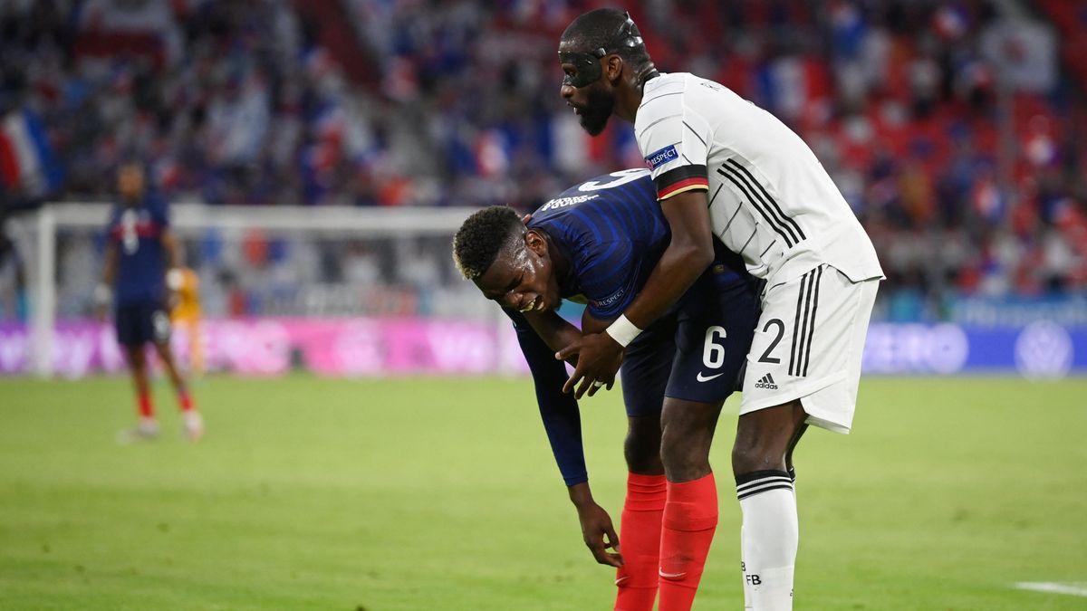Germany’s  Antoine Rüdiger shortly after  taking  a bit out of Paul Pogba, for some reason.
