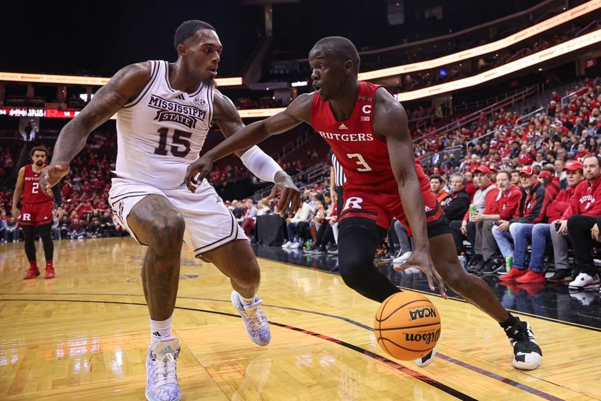 Dec 23, 2023; Newark, NY, USA; Rutgers Scarlet Knights forward Mawot Mag (3) dribbles against Mississippi State Bulldogs forward Jimmy Bell Jr. (15) during the first half at Prudential Center.