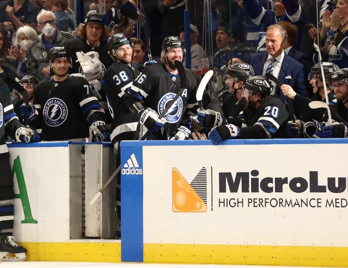 Apr 17, 2024; Tampa, Florida, USA; Tampa Bay Lightning right wing Nikita Kucherov (86) is congratulated by left wing Brandon Hagel (38) after his 100th assist of the year on a goal by center Brayden Point (21) during the second period at Amalie Arena.