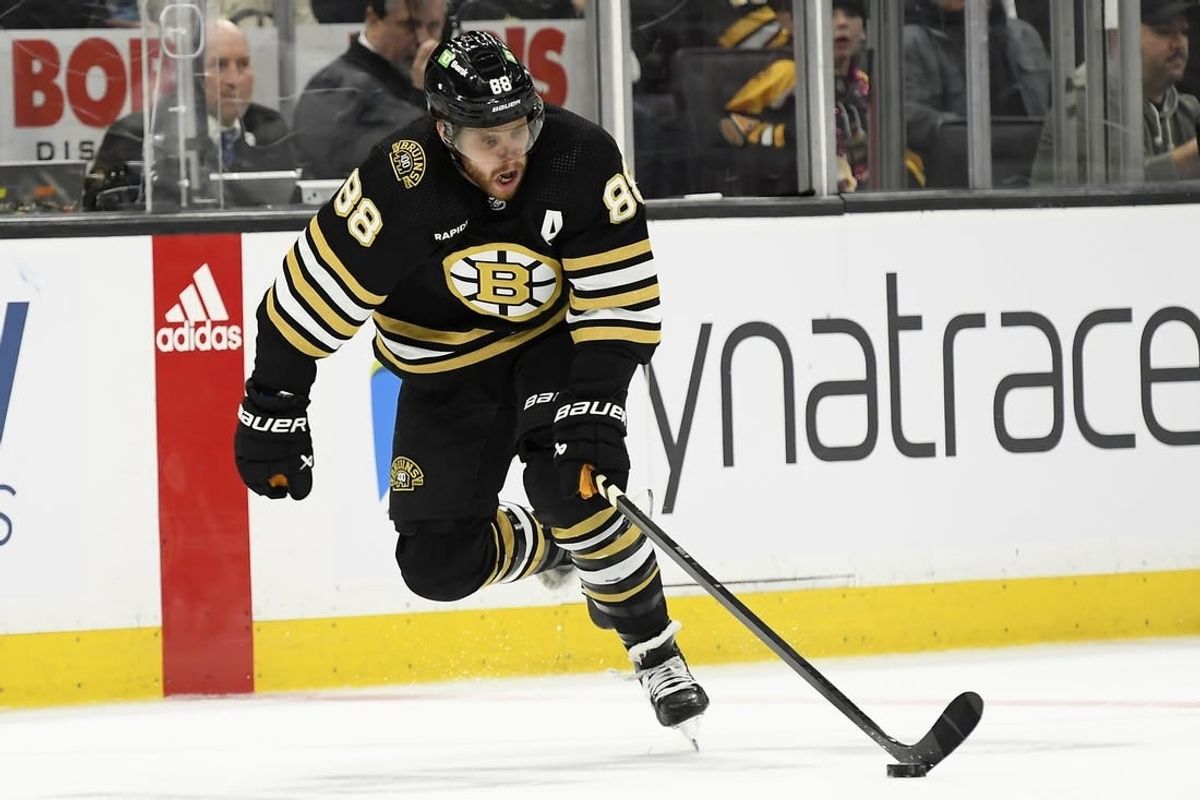 Feb 13, 2024; Boston, Massachusetts, USA;  Boston Bruins right wing David Pastrnak (88) skates with the puck during the third period against the Tampa Bay Lightning at TD Garden.