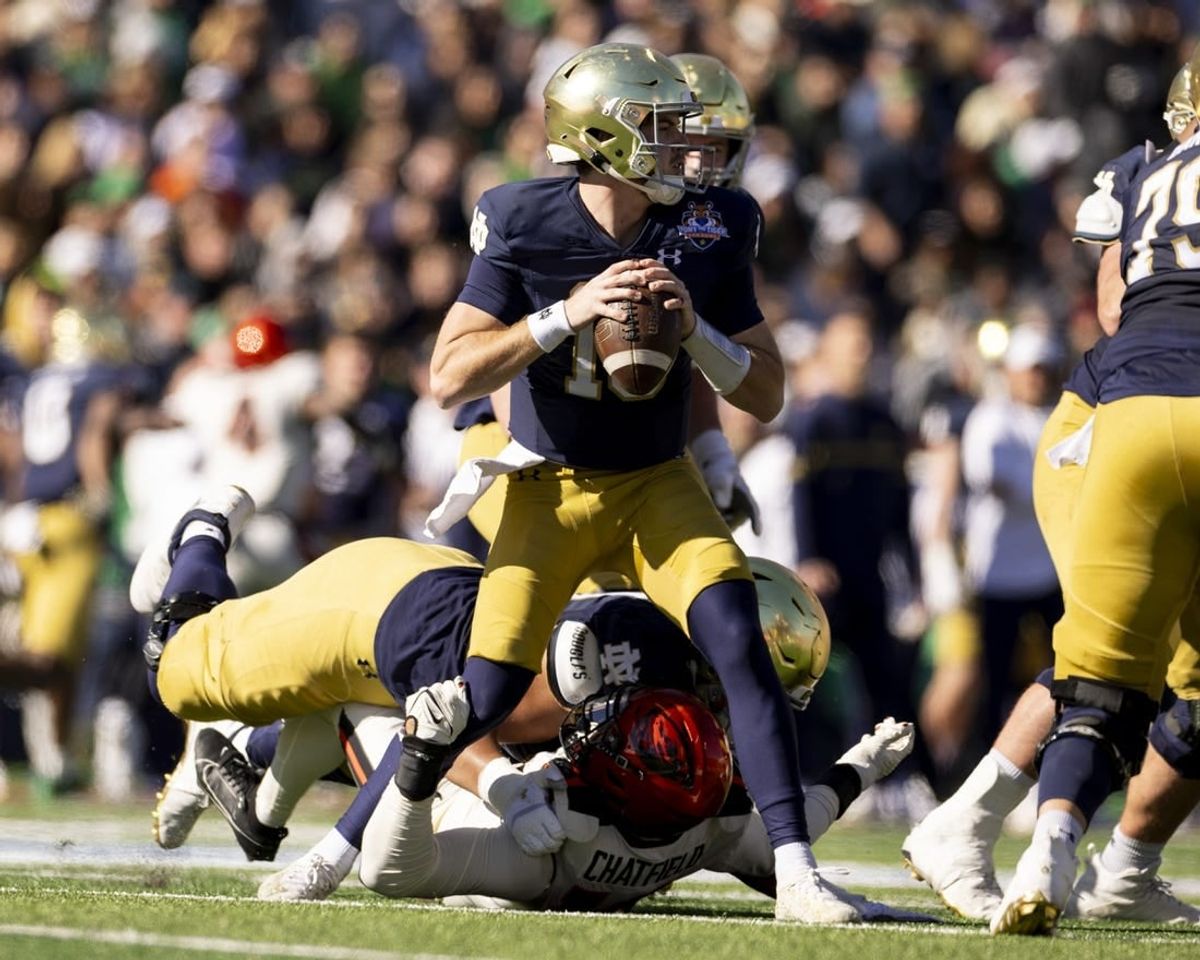 Dec 29, 2023; El Paso, TX, USA; Notre Dame Fighting Irish quarterback Steve Angeli (18) drops back to pass against the Oregon State Beavers defense in the first half at Sun Bowl Stadium.