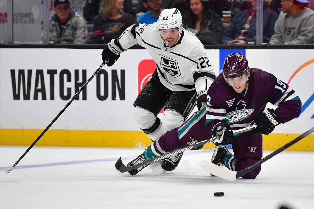 Apr 9, 2024; Anaheim, California, USA; Los Angeles Kings left wing Kevin Fiala (22) plays for the puck against Anaheim Ducks right wing Troy Terry (19) during the second period at Honda Center.