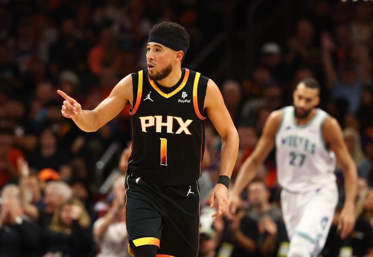 Nov 15, 2023; Phoenix, Arizona, USA; Phoenix Suns guard Devin Booker (1) reacts against the Minnesota Timberwolves in the second half at Footprint Center.