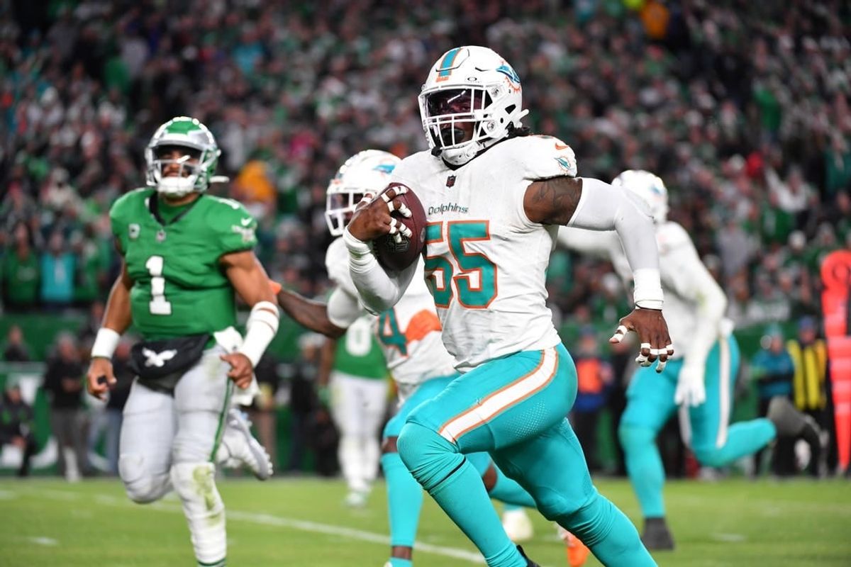 Oct 22, 2023; Philadelphia, Pennsylvania, USA; Miami Dolphins linebacker Jerome Baker (55) returns an interception for a touchdown  during the third quarter against the Philadelphia Eagles at Lincoln Financial Field.
