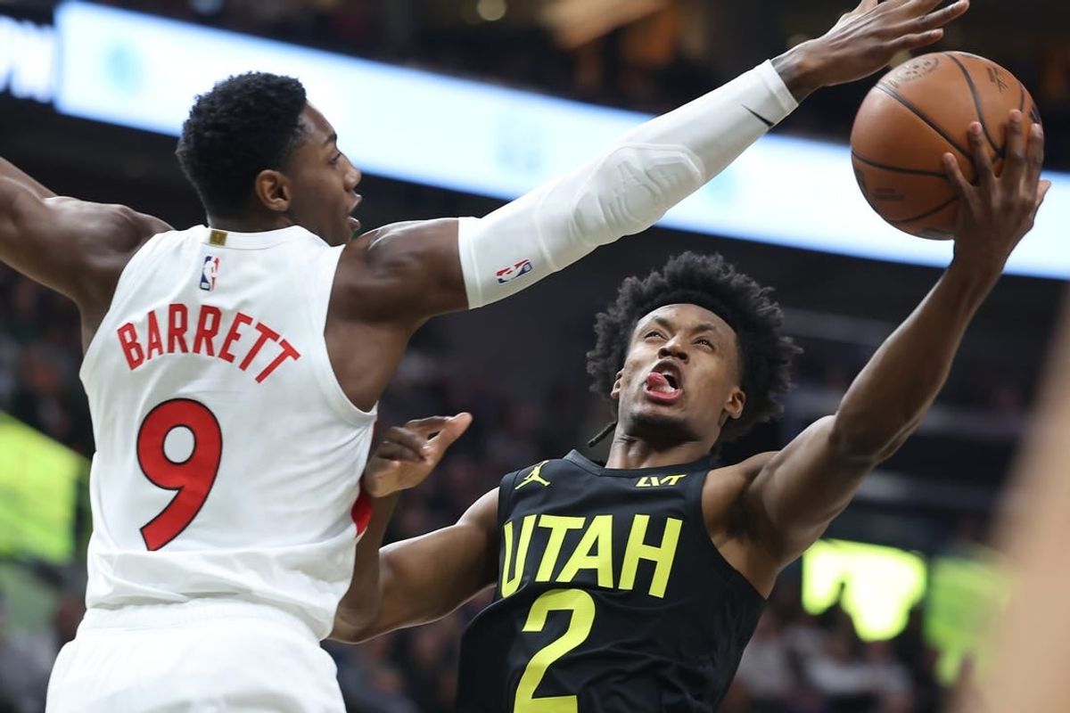 Jan 12, 2024; Salt Lake City, Utah, USA; Utah Jazz guard Collin Sexton (2) goes to the basket against Toronto Raptors guard RJ Barrett (9) during the first quarter at Delta Center.