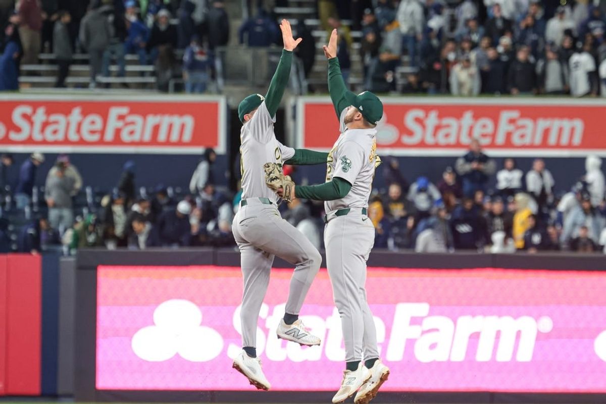 Apr 25, 2024; Bronx, New York, USA; Oakland Athletics third baseman Max Schuemann (12) celebrates with shortstop Nick Allen (10) after defeating the New York Yankees at Yankee Stadium.