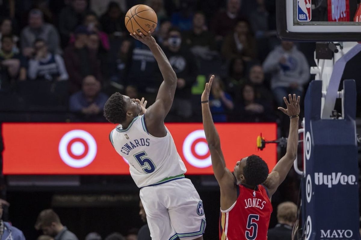 Jan 3, 2024; Minneapolis, Minnesota, USA; Minnesota Timberwolves guard Anthony Edwards (5) shoots the ball over New Orleans Pelicans forward Herbert Jones (5) in the second half at Target Center.