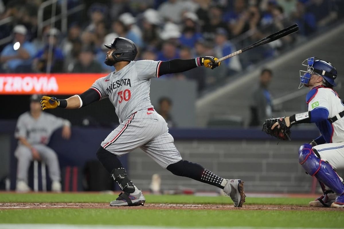 May 10, 2024; Toronto, Ontario, CAN; Minnesota Twins first baseman Carlos Santana (30) hits a solo home run against the Toronto Blue Jays during the fifth inning at Rogers Centre.
