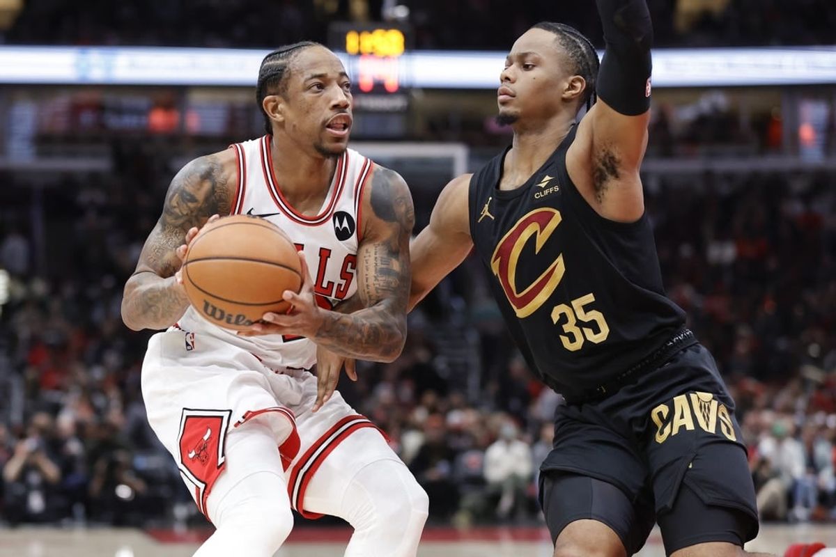 Dec 23, 2023; Chicago, Illinois, USA; Chicago Bulls forward DeMar DeRozan (11) drives to the basket against Cleveland Cavaliers forward Isaac Okoro (35) during the first half at United Center.