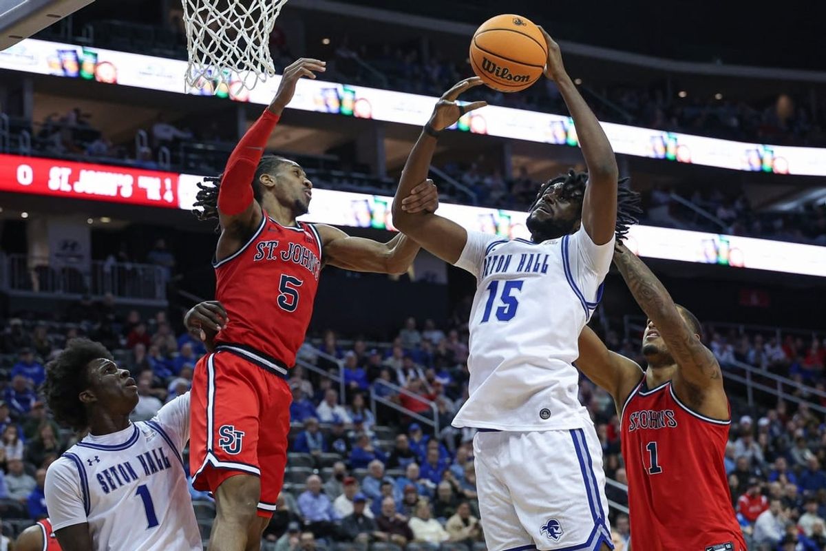 Jan 16, 2024; Newark, New Jersey, USA; Seton Hall Pirates center Jaden Bediako (15) rebounds against St. John's Red Storm center Joel Soriano (11) and guard Daniss Jenkins (5) in front of guard Kadary Richmond (1) during the first half at Prudential Center.