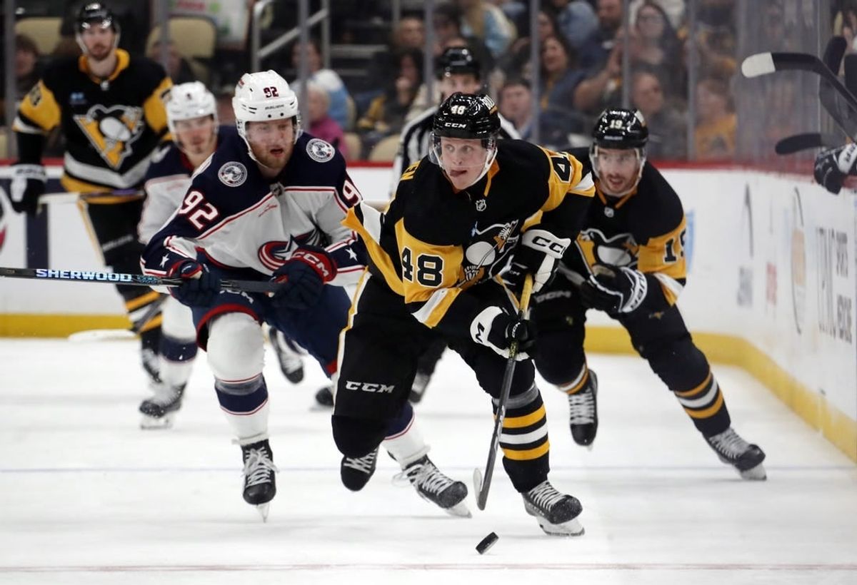 Mar 5, 2024; Pittsburgh, Pennsylvania, USA; Pittsburgh Penguins right wing Valtteri Puustinen (48) skates with the puck against the Columbus Blue Jackets during the third period at PPG Paints Arena. The Penguins won 5-3.