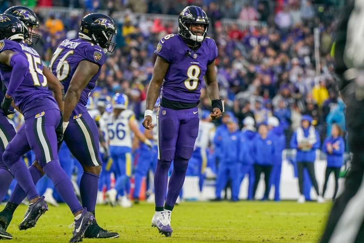 Dec 10, 2023; Baltimore, Maryland, USA;  Baltimore Ravens quarterback Lamar Jackson (8) celebrates after the team scores a touchdown against the Los Angeles Rams during the fourth quarter at M&T Bank Stadium.