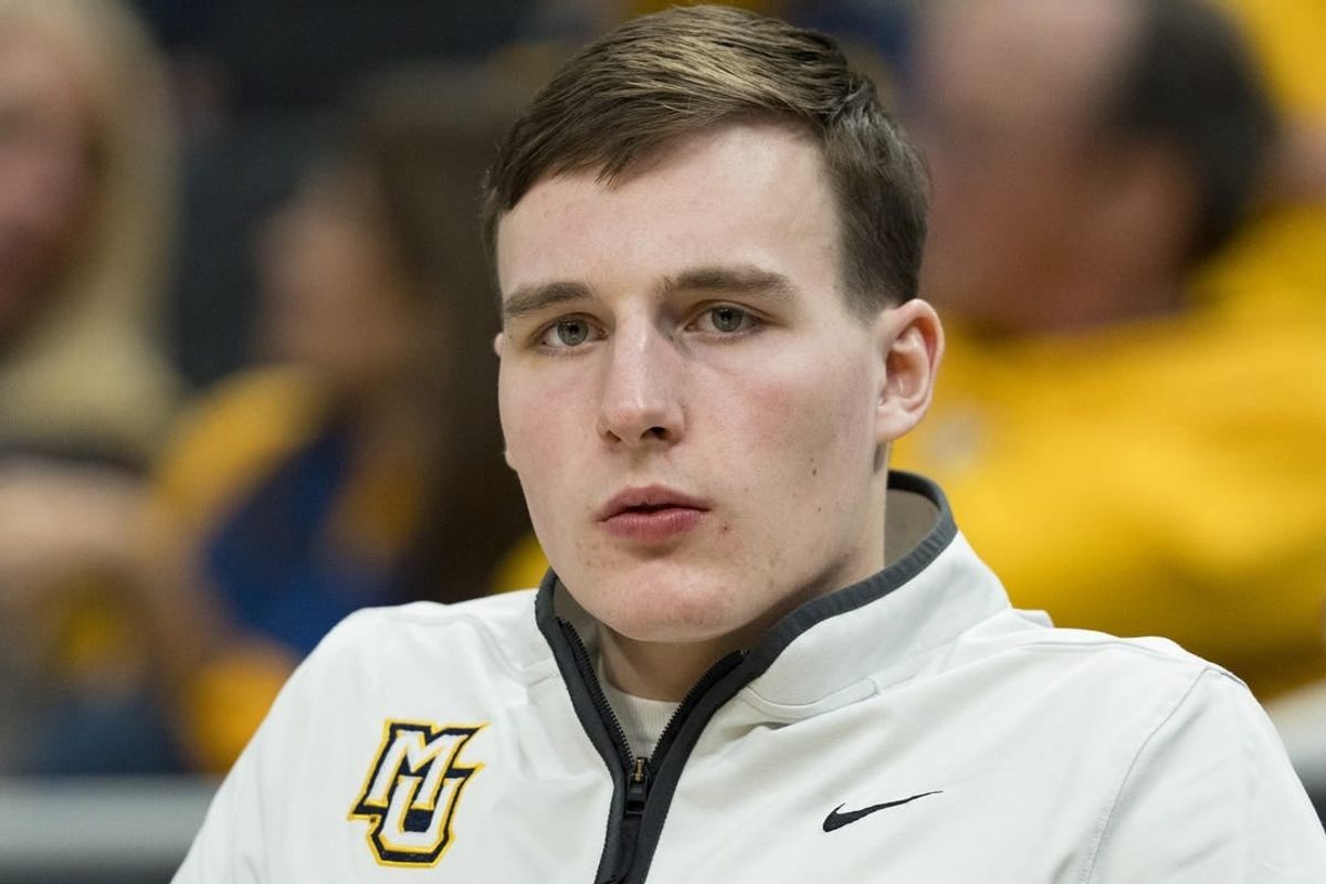 Mar 6, 2024; Milwaukee, Wisconsin, USA;  Marquette Golden Eagles guard Tyler Kolek looks on from the bench during the second half against the Connecticut Huskies at Fiserv Forum.