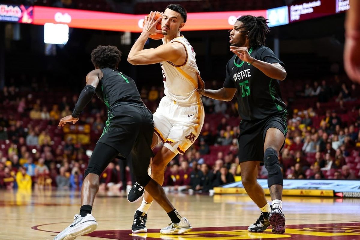 Nov 18, 2023; Minneapolis, Minnesota, USA; Minnesota Golden Gophers forward Dawson Garcia (3) drives to the basket while USC Upstate Spartans forward Ahmir Langlais (35) and guard Nick Alves (1) defends during the first half at Williams Arena.