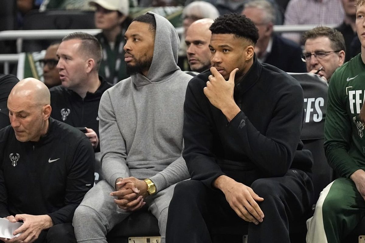 Apr 30, 2024; Milwaukee, Wisconsin, USA;  Milwaukee Bucks guard Damian Lillard and forward Giannis Antetokounmpo watch from the bench during the first quarter during game five of the first round for the 2024 NBA playoffs against the Indiana Pacers at Fiserv Forum.