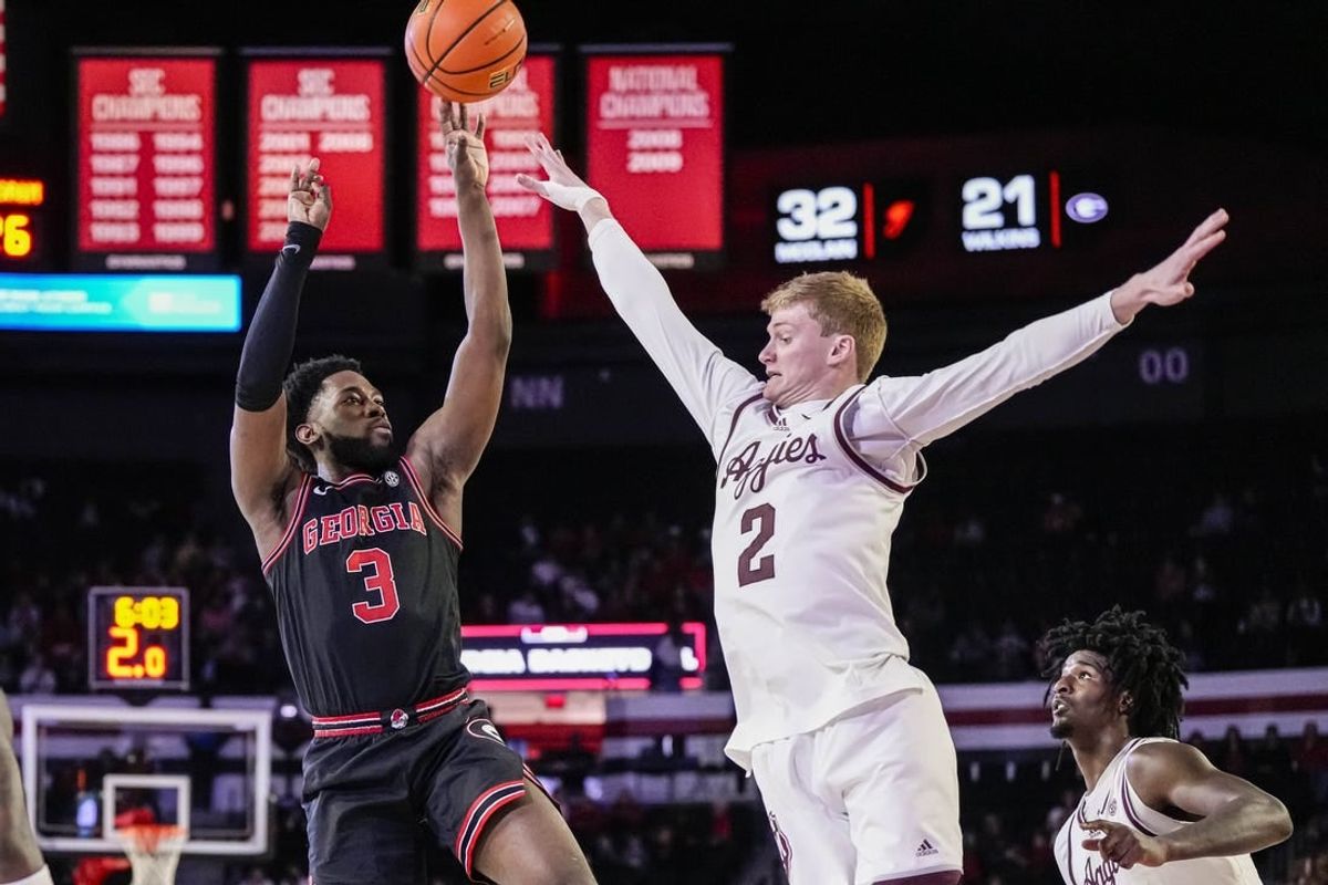 Mar 2, 2024; Athens, Georgia, USA; Georgia Bulldogs guard Noah Thomasson (3) shoots over Texas A&M Aggies guard Hayden Hefner (2) during the first half at Stegeman Coliseum.