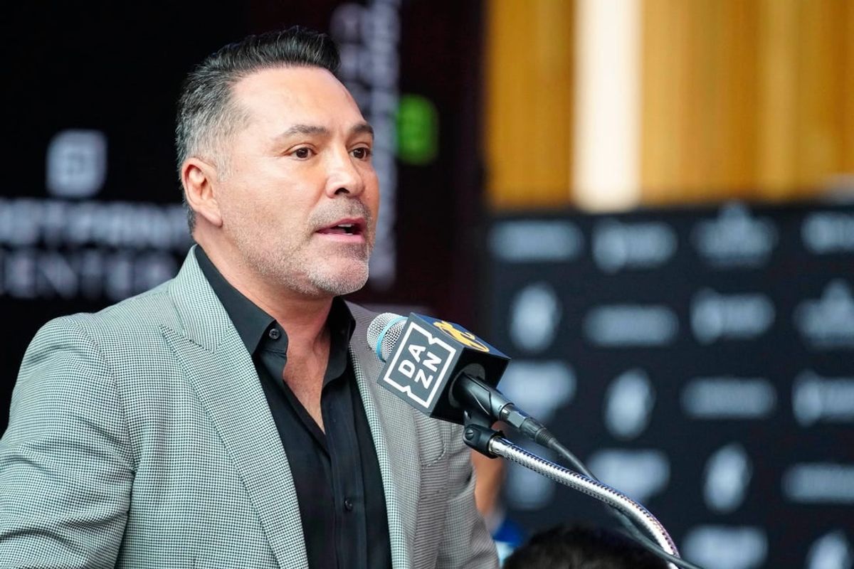 Jan. 25, 2024; Phoenix, Ariz; USA; Oscar De La Hoya speaks about boxer Jamie Munguia (center) about the Munguia v Ryder main event during a press conference for Golden Boy boxing event.