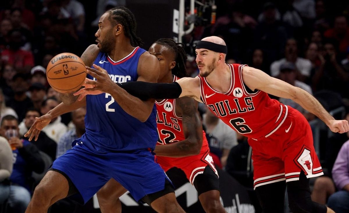Mar 9, 2024; Los Angeles, California, USA; Chicago Bulls guard Alex Caruso (6) knocks the ball away from LA Clippers forward Kawhi Leonard (2) during the second quarter at Crypto.com Arena.