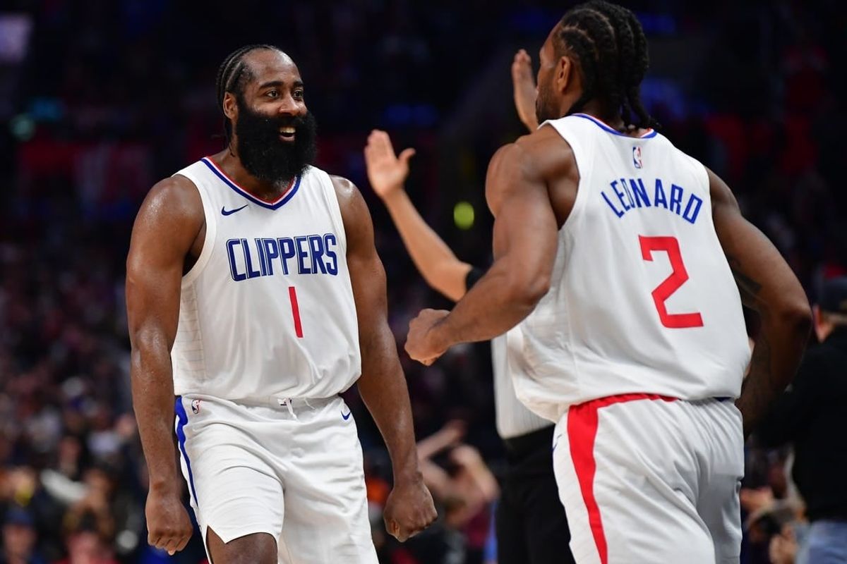 Jan 21, 2024; Los Angeles, California, USA; Los Angeles Clippers guard James Harden (1) reacts after forward Kawhi Leonard (2) scores three point basket against the Brooklyn Nets during the second half at Crypto.com Arena.
