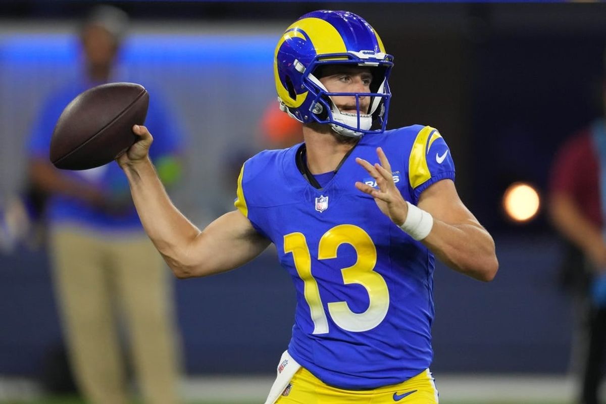 Aug 12, 2023; Inglewood, California, USA; Los Angeles Rams quarterback Stetson Bennett (13) throws the ball in the second half against the Los Angeles Chargers at SoFi Stadium.