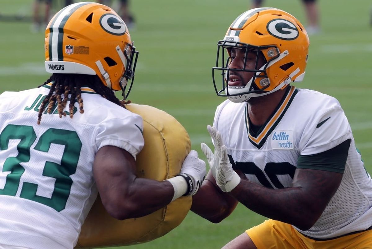 July 29, 2021; Green Bay, WI, USA; Green Bay Packers running back Aaron Jones (33) and running back A.J. Dillon (28) take part in a drill during the second day of training camp Thursday, July 29, 2021 in Green Bay, Wis.Mandatory Credit: Mark Hoffman-USA TODAY NETWORK