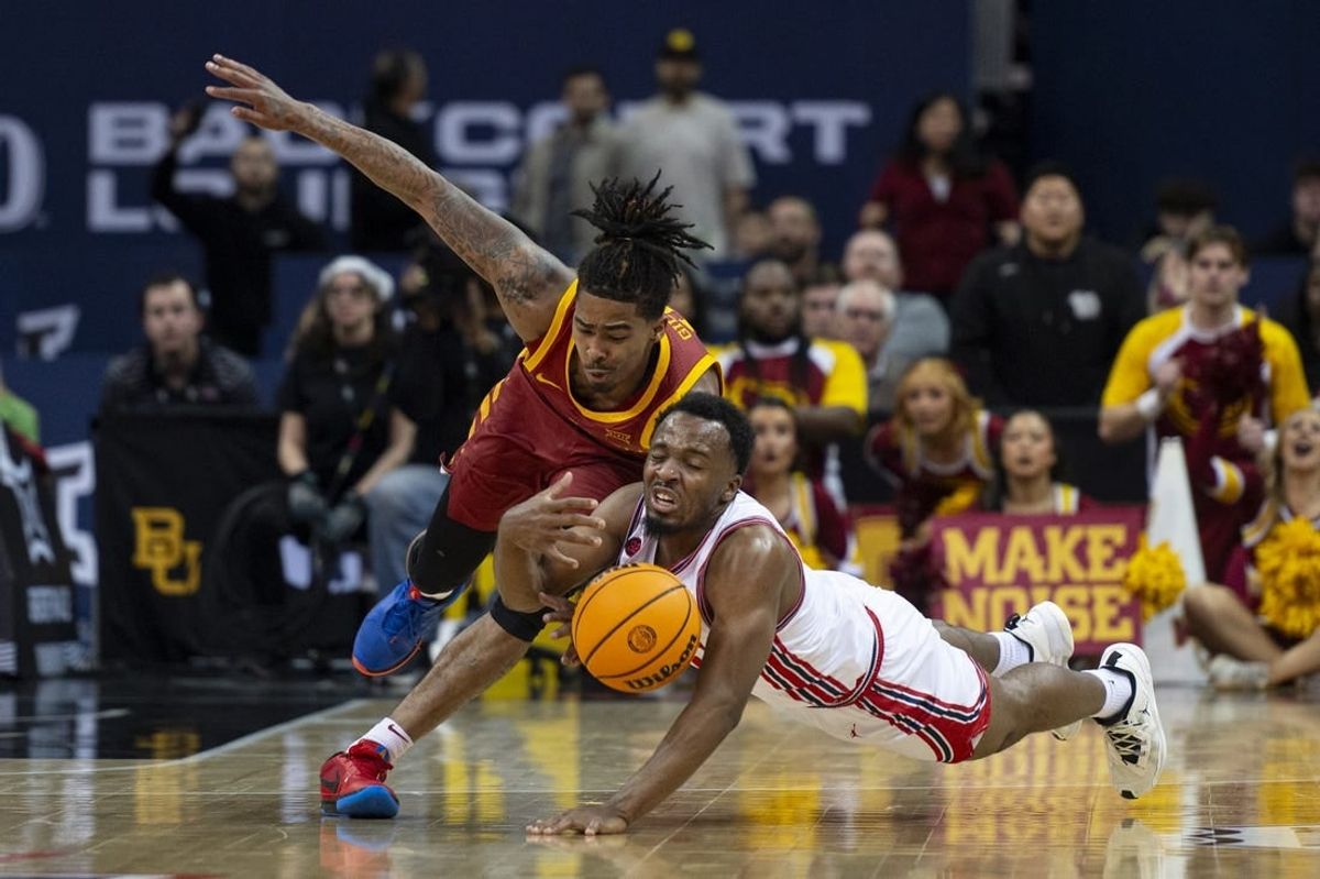 Mar 16, 2024; Kansas City, MO, USA; Iowa State Cyclones guard Keshon Gilbert (10) and Houston Cougars guard LJ Cryer (4) dive for a loose ball in the first half at T-Mobile Center.