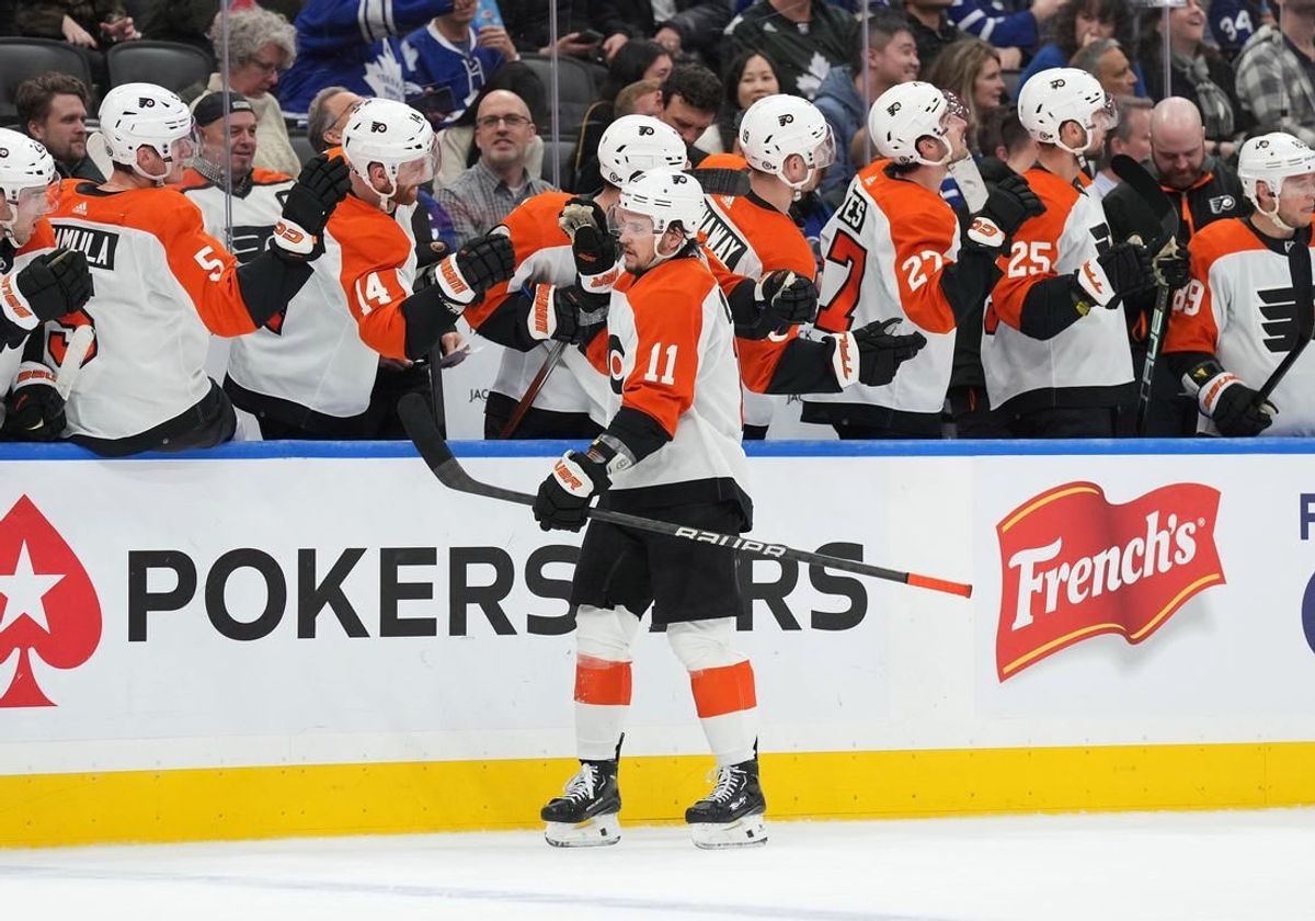 Feb 15, 2024; Toronto, Ontario, CAN; Philadelphia Flyers right wing Travis Konecny (11) celebrates with teammates after scoring a goal against the Toronto Maple Leafs during the third period at Scotiabank Arena.