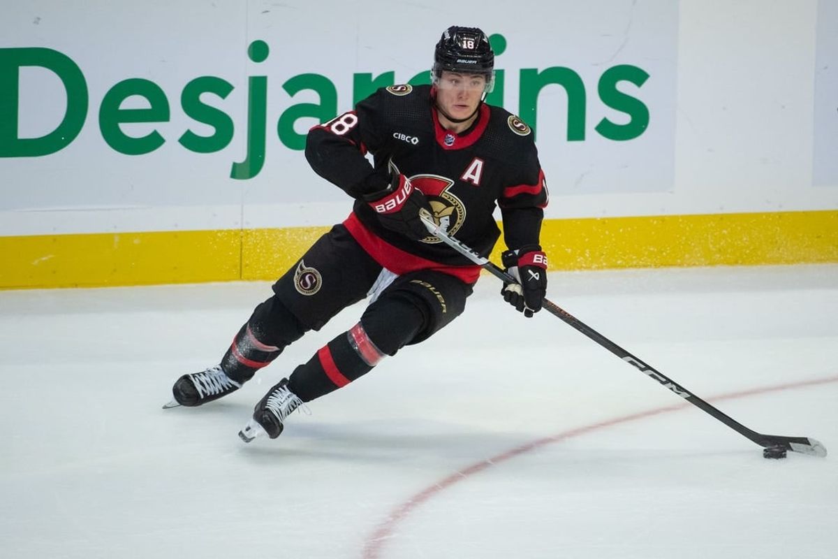 Nov 9, 2023; Ottawa, Ontario, CAN; Ottawa Senators center Tim Stutzle (18) skates with the puck in the third period against the Vancouver Canucks at the Canadian Tire Centre.
