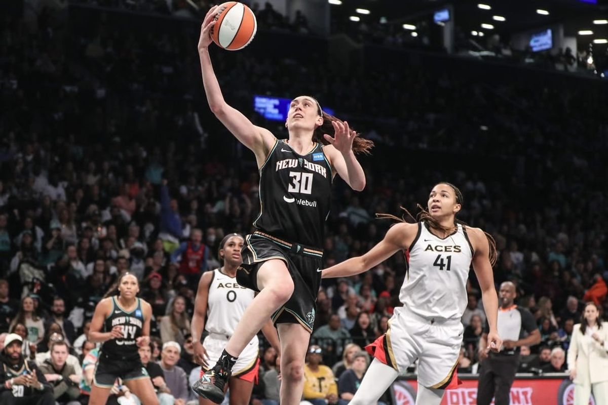 Oct 15, 2023; Brooklyn, New York, USA; New York Liberty forward Breanna Stewart (30) drives past Las Vegas Aces center Kiah Stokes (41) for a layup in the third quarter during game three of the 2023 WNBA Finals at Barclays Center.