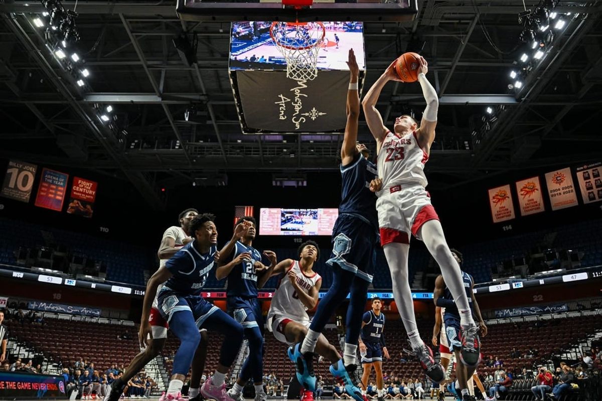 Nov 19, 2023; Uncasville, CT, USA; Washington State Cougars forward Andrej Jakimovski (23) jumps to shoot the ball challenged by Rhode Island Rams guard Zek Montgomery (0) during the second half at Mohegan Sun Arena.