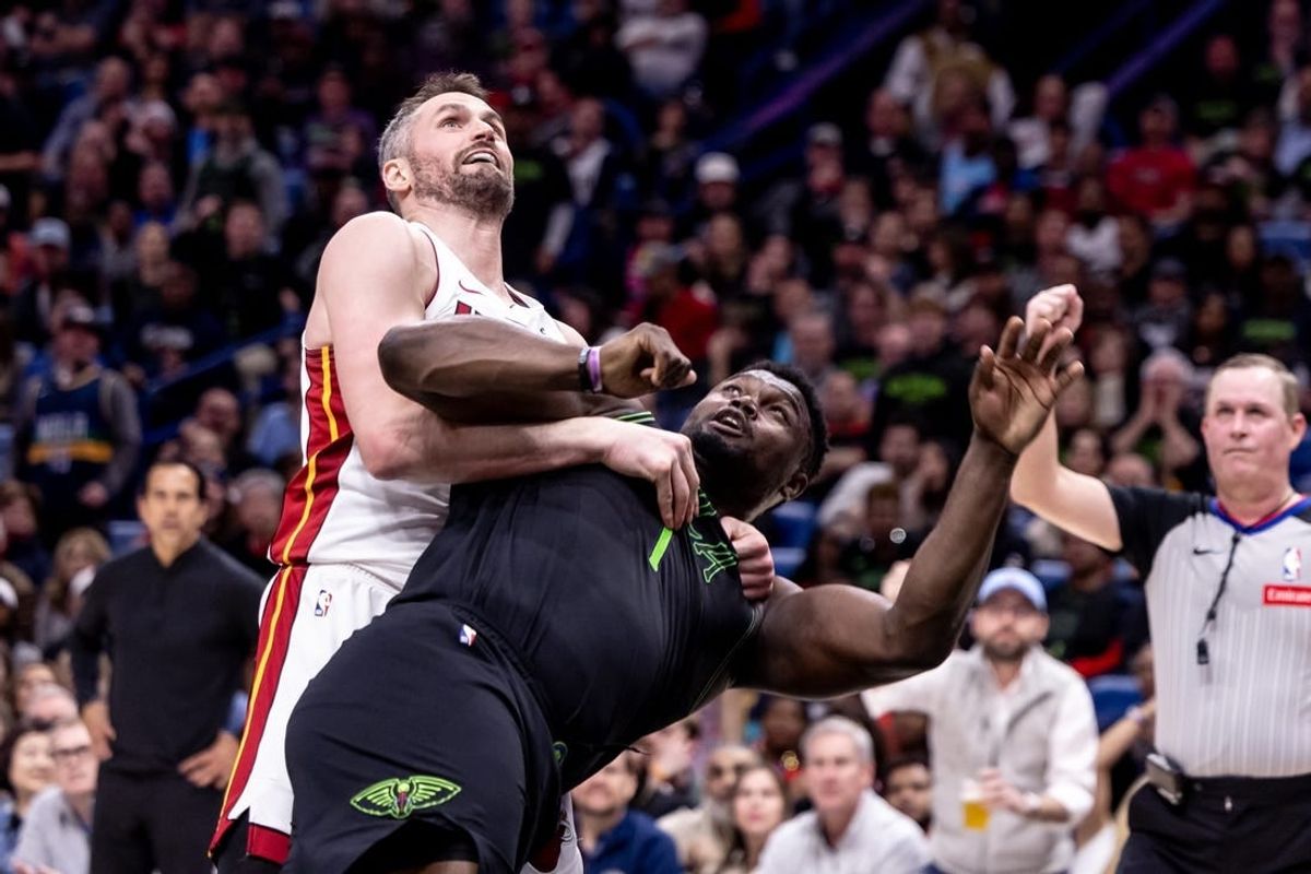 Feb 23, 2024; New Orleans, Louisiana, USA;  Miami Heat forward Kevin Love (42) fouls New Orleans Pelicans forward Zion Williamson (1) which starts a melee causing three players to be ejected during the second half at Smoothie King Center.