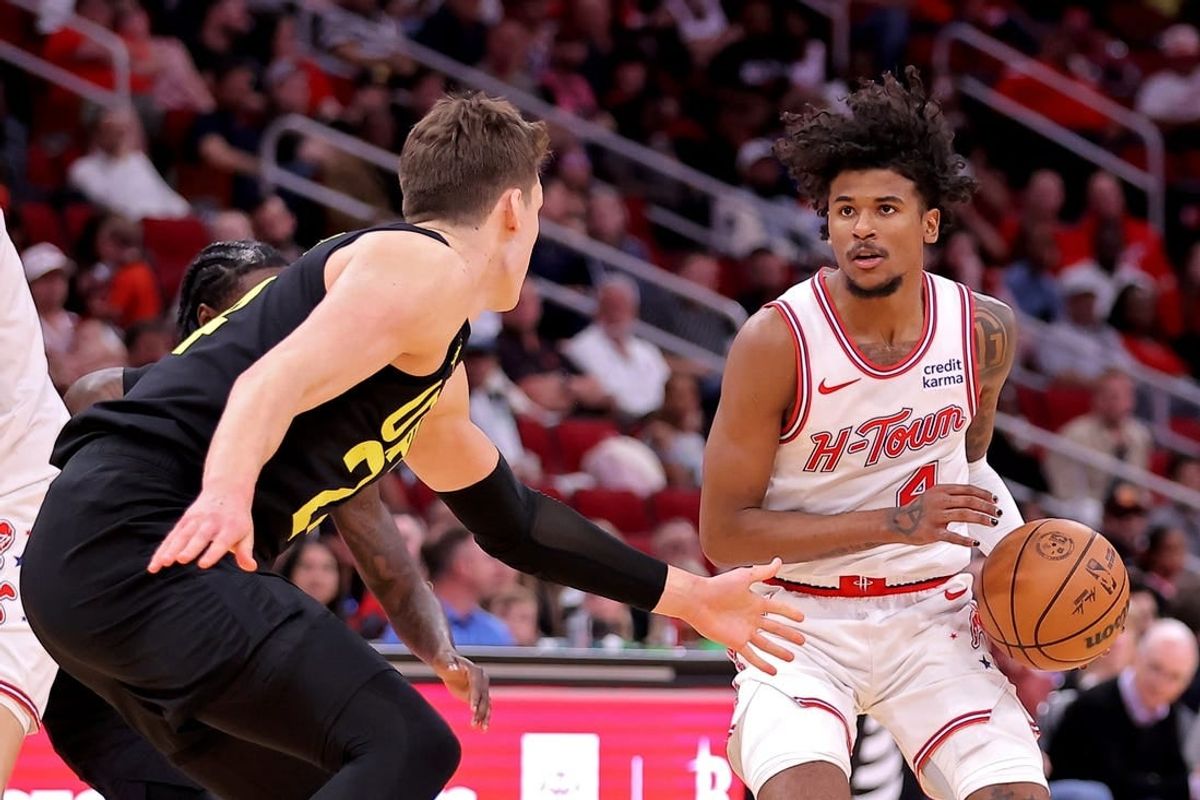 Mar 23, 2024; Houston, Texas, USA; Houston Rockets guard Jalen Green (4) handles the ball against Utah Jazz center Walker Kessler (24) during the third quarter at Toyota Center.