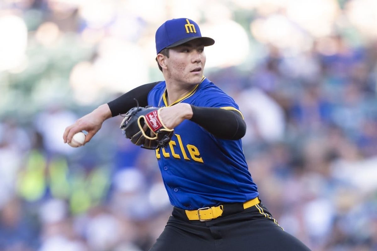 May 8, 2024; Seattle, Washington, USA; Seattle Mariners starter Bryan Woo (22) delivers a pitch during the first inning against the Oakland Athletics at Lumen Field.