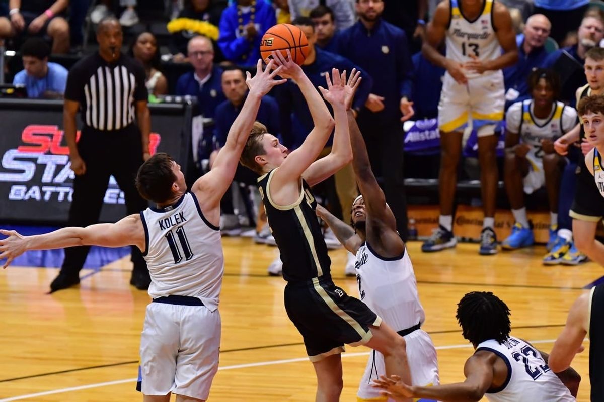 Nov 22, 2023; Honolulu, HI, USA; Purdue Boilermakers guard Fletcher Loyer (2) shoots the ball while defended by Marquette Golden Eagles guard Tyler Kolek (11) and guard Chase Ross (2) during the first period at SimpliFi Arena at Stan Sheriff Center.