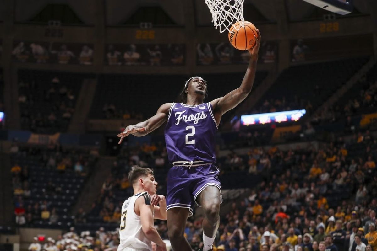 Mar 6, 2024; Morgantown, West Virginia, USA; TCU Horned Frogs forward Emanuel Miller (2) shoots in the lane during the first half against the West Virginia Mountaineers at WVU Coliseum.