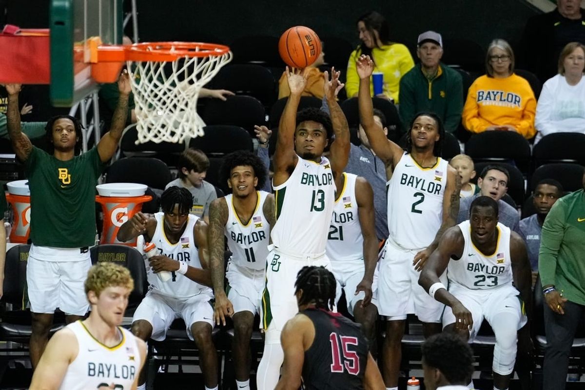 Nov 28, 2023; Waco, Texas, USA; Baylor Bears guard Langston Love (13) scores a three-point basket against Nicholls State Colonels forward Jamal West Jr. (15) during the second half at Ferrell Center.